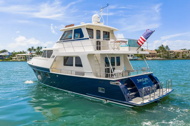 Slide: The Image of 2017 Marlow Explorer 49E yacht cruising on clear blue waters. - 26