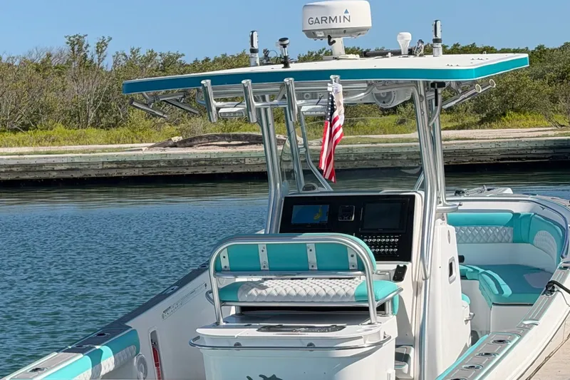 Slide: The Image of 2007 Pro-Line 29 Super Sport boat with Garmin equipment, docked in calm waters. - 10