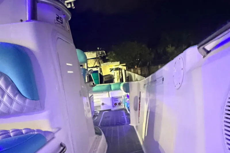 Slide: The Image of 2007 Pro-Line 29 Super Sport boat interior with blue lighting at night. - 3