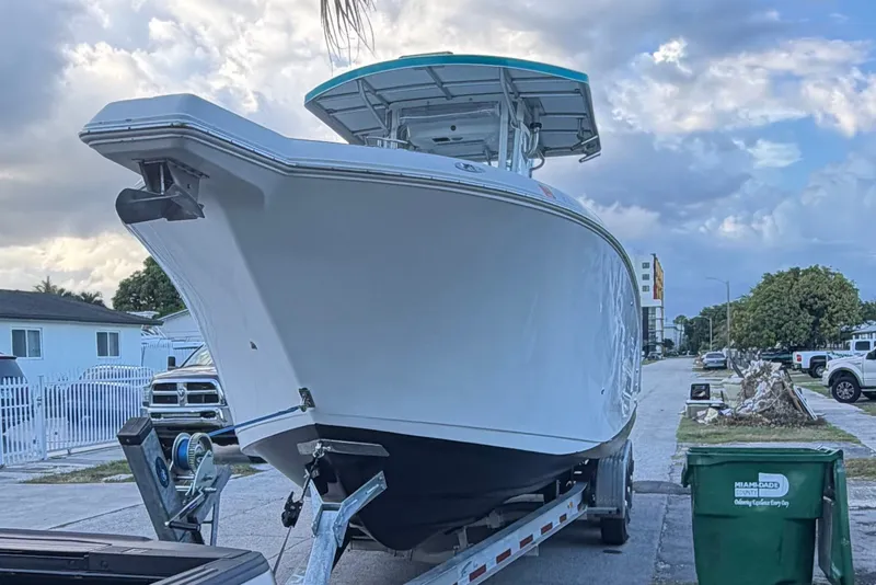 Slide: The Image of 2007 Pro-Line 29 Super Sport boat on trailer in residential area. - 7