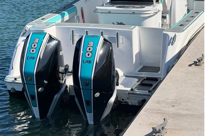 Slide: The Image of 2007 Pro-Line 29 Super Sport boat with twin Mercury 300 V8 engines docked. - 9