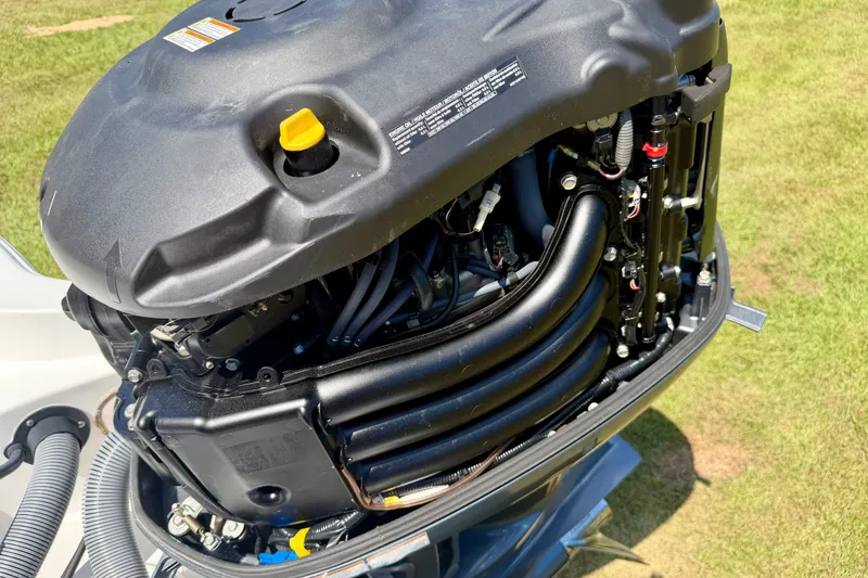 Slide: The Image of 2017 Sea Hunt BX25BR boat engine, detailed view of components and wiring. - 13