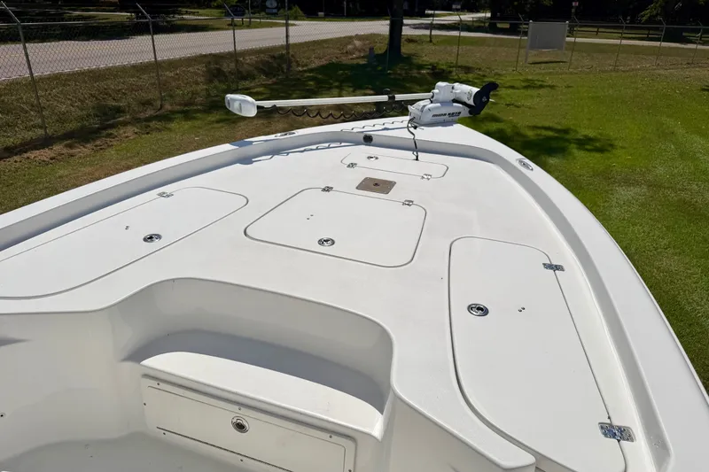 Slide: The Image of 2017 Sea Hunt BX25BR boat deck with storage compartments and trolling motor. - 4