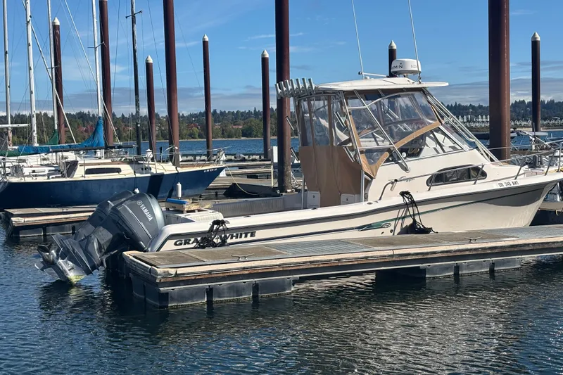 Slide: The Image of 2005 Grady White 282 Sailfish boat docked at marina with Yamaha outboard motor. - 38