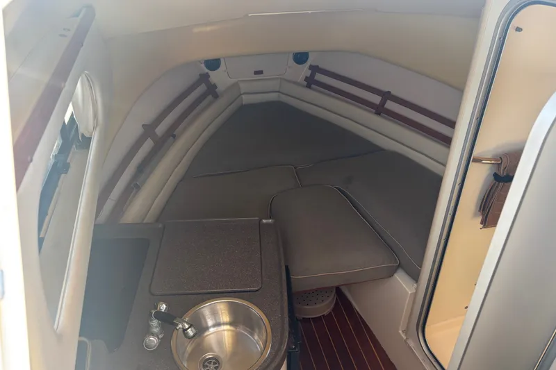 Slide: The Image of Interior cabin of 2005 Grady White 282 Sailfish with sink and seating area. - 24