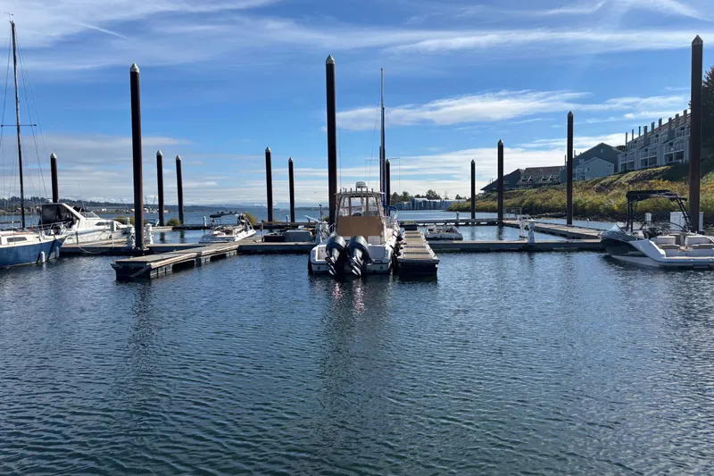 Slide: The Image of Docked 2005 Grady White 282 Sailfish boat at marina under blue sky. - 34