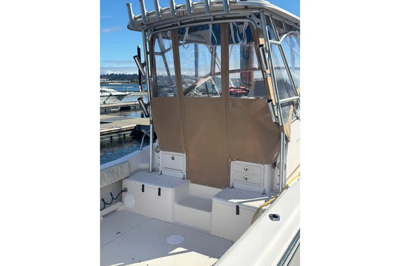Slide: The Image of 2005 Grady White 282 Sailfish boat with enclosed cockpit at marina. - 23