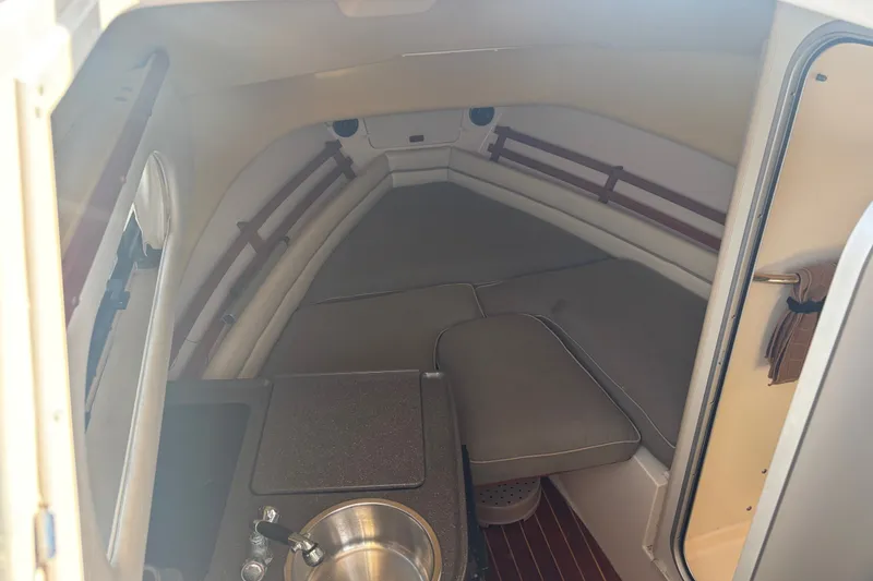 Slide: The Image of Interior cabin of 2005 Grady White 282 Sailfish boat with seating and sink. - 40