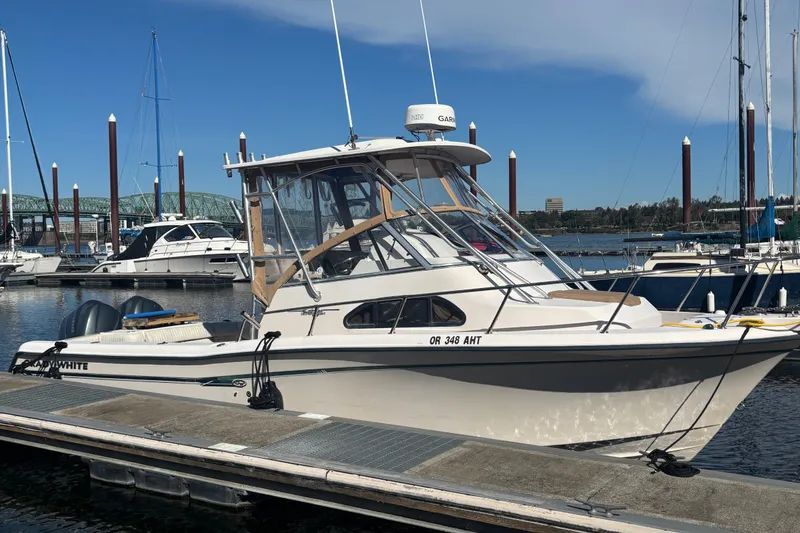 The Image of 2005 Grady White 282 Sailfish boat docked at marina under clear blue sky. - 22