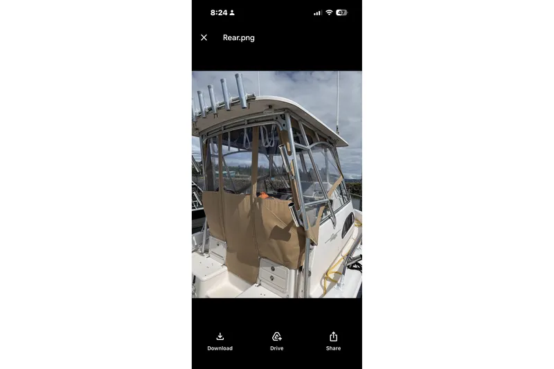 Slide: The Image of 2005 Grady White 282 Sailfish boat with covered cockpit and rod holders. - 21