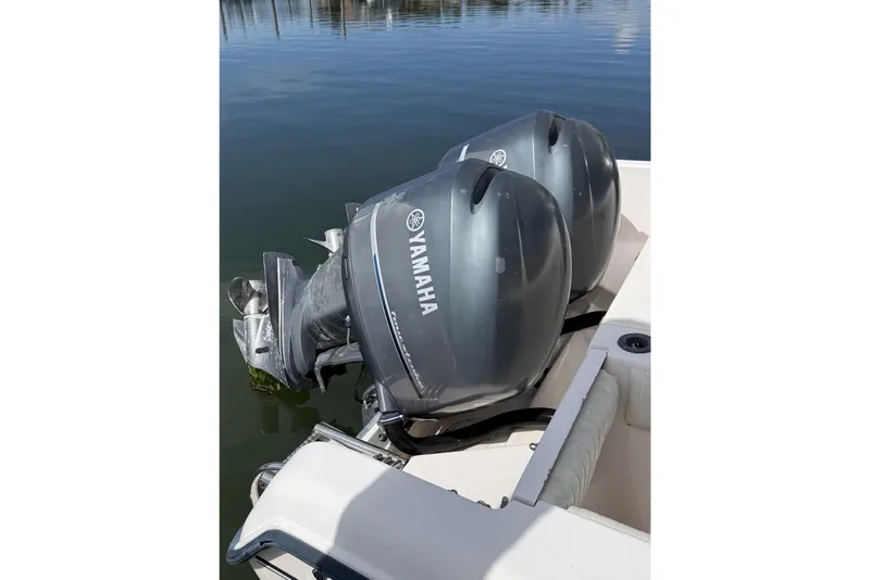 Slide: The Image of Twin Yamaha outboard engines on a 2005 Grady White 282 Sailfish boat. - 19