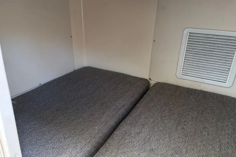 Slide: The Image of Interior cabin of 2005 Grady White 282 Sailfish with cushioned seating. - 7