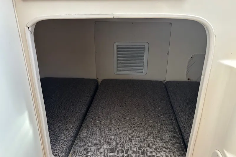 Slide: The Image of 2005 Grady White 282 Sailfish cabin interior with cushioned seating. - 15
