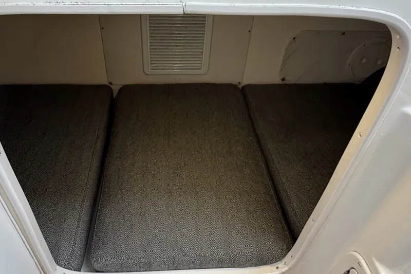 Slide: The Image of 2005 Grady White 282 Sailfish cabin interior with cushioned sleeping area. - 6
