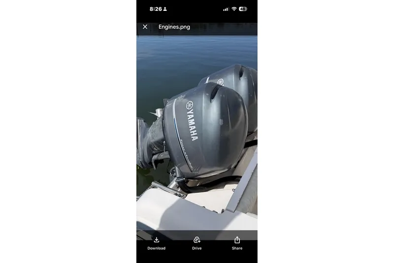 Slide: The Image of Twin Yamaha outboard engines on a 2005 Grady White 282 Sailfish boat. - 12