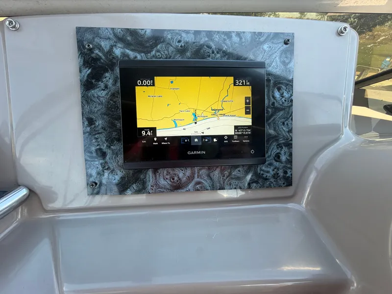 Slide: The Image of A Garmin navigation system is embedded in the dashboard of a 2000 Carver 396 Motor Yacht. - 14