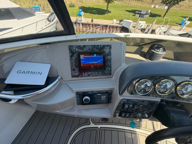 Slide: The Image of The cockpit of a 2000 Carver 396 Motor Yacht features a modern navigation system and instruments. - 13