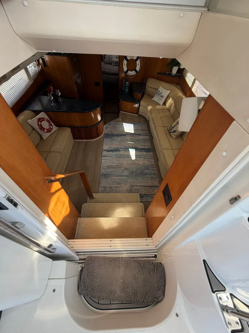 Slide: The Image of Interior of a 2000 Carver 396 Motor Yacht with cozy living area and kitchen. - 36