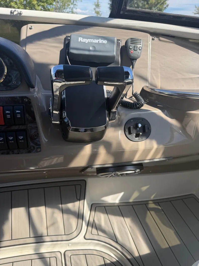 Slide: The Image of The image shows the helm of a 2000 Carver 396 Motor Yacht with Raymarine equipment. - 28
