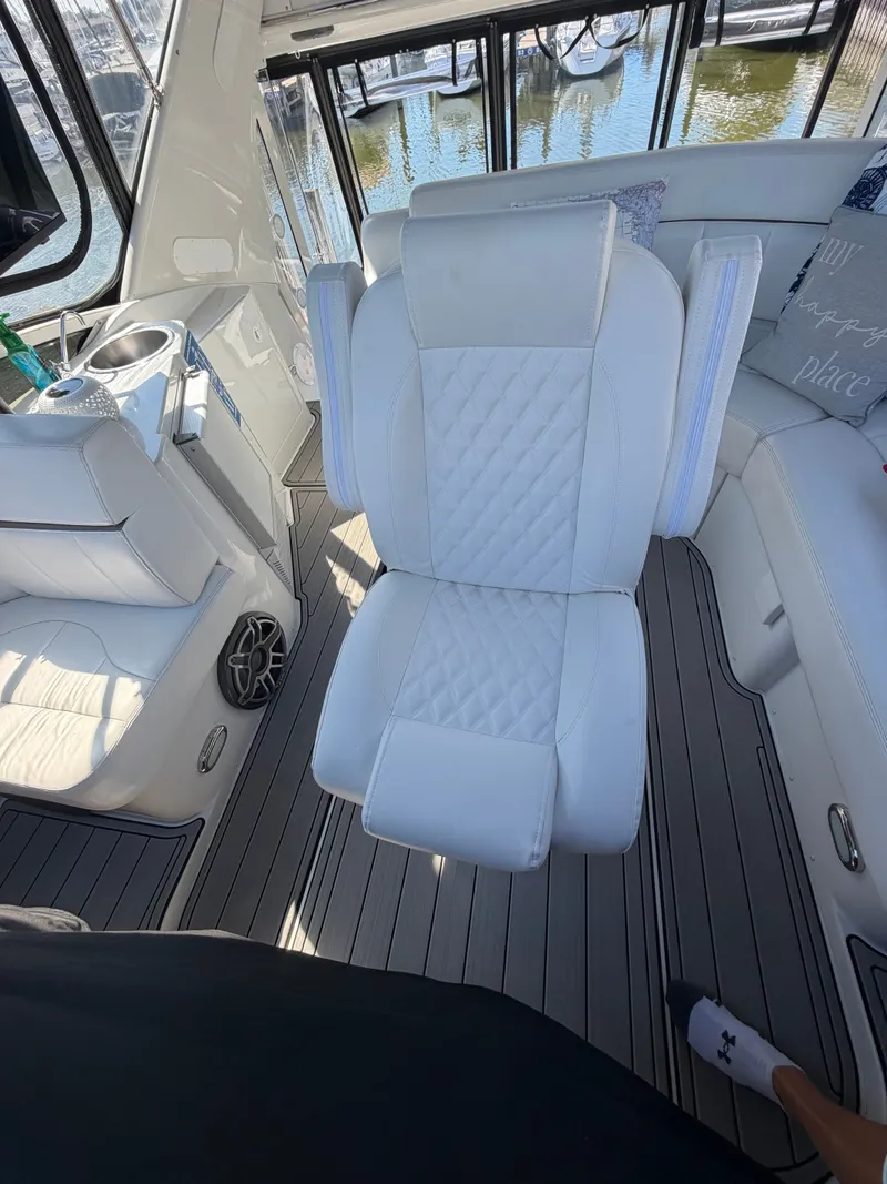 Slide: The Image of The interior of a 2000 Carver 396 Motor Yacht features white upholstery and a modern design. - 19