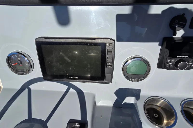 Slide: The Image of Dashboard of 2023 Bayliner Trophy T24CC with Garmin display and controls. - 18