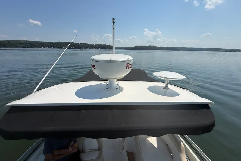 Slide: The Image of 2013 Sea Ray Sundancer 350 cruising on a calm lake under a clear sky. - 31