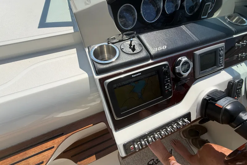 Slide: The Image of Control panel of a 2013 Sea Ray Sundancer 350 boat with navigation equipment. - 30