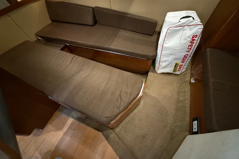 Slide: The Image of Interior of 2013 Sea Ray Sundancer 350 with seating and safety gear bag. - 47