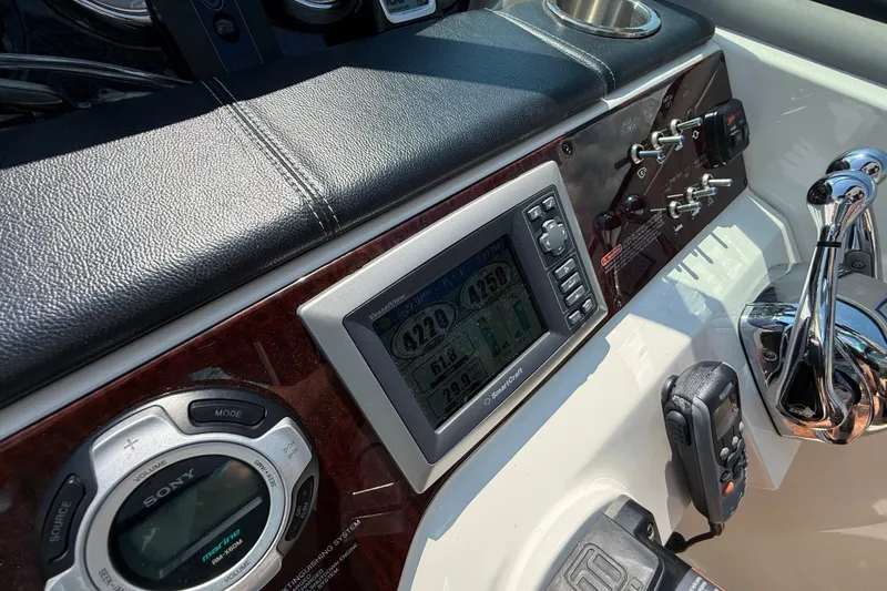 Slide: The Image of Control panel of 2013 Sea Ray Sundancer 350 boat with navigation and audio systems. - 27
