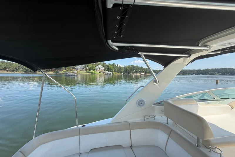 Slide: The Image of 2013 Sea Ray Sundancer 350 boat interior with lake view and seating area. - 21