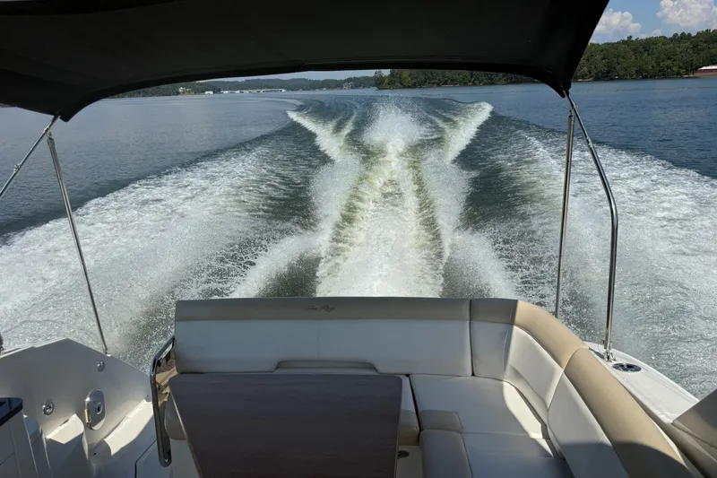 Slide: The Image of 2013 Sea Ray Sundancer 350 cruising on a lake, leaving a wake behind. - 32