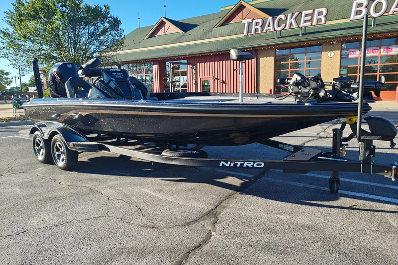 Slide: The Image of 2027 Nitro Z21 XL Pro boat on trailer outside Tracker Boats store. - 1