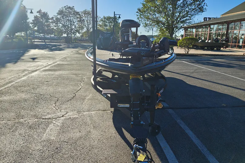 Slide: The Image of 2027 Nitro Z21 XL Pro boat on trailer in sunny parking lot. - 2