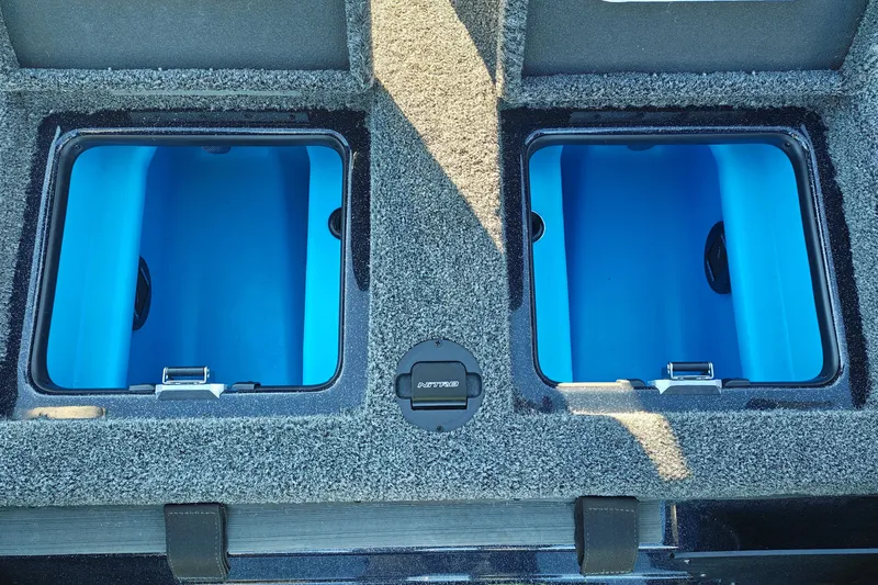 Slide: The Image of 2027 Nitro Z21 XL Pro boat storage compartments with blue interior and carpeted exterior. - 40