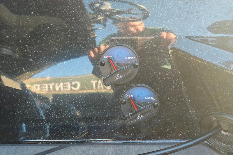 Slide: The Image of 2027 Nitro Z21 XL Pro boat controls with open and closed indicators. - 20