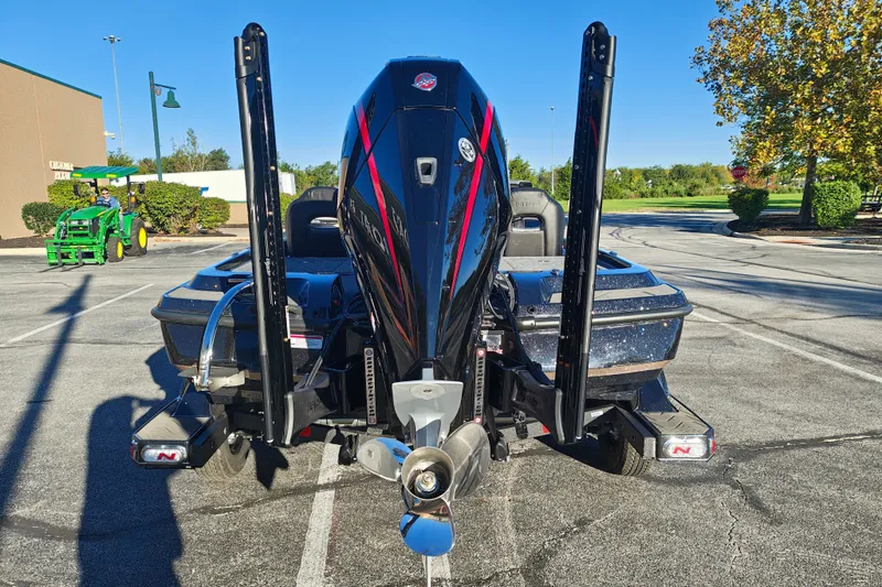 Slide: The Image of 2027 Nitro Z21 XL Pro boat with powerful engine in a parking lot. - 9