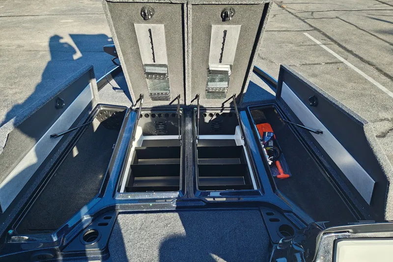 Slide: The Image of 2027 Nitro Z21 XL Pro boat storage compartments open, showcasing organized interior layout. - 26