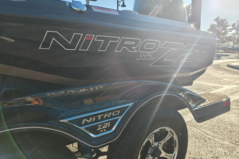 Slide: The Image of 2027 Nitro Z21 XL Pro boat with sleek design and branding in sunlight. - 7