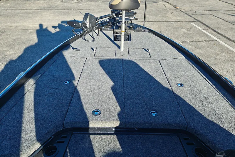 Slide: The Image of 2027 Nitro Z21 XL Pro boat deck with trolling motor and storage compartments. - 24
