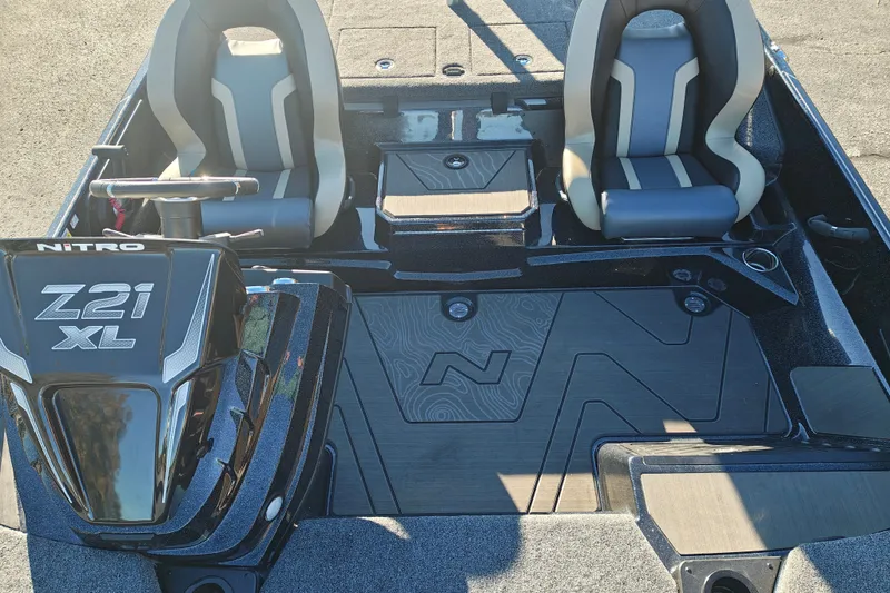 Slide: The Image of 2027 Nitro Z21 XL Pro boat interior with dual seats and steering console. - 36
