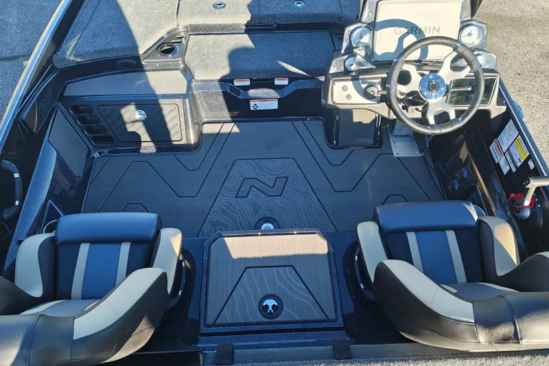 Slide: The Image of 2027 Nitro Z21 XL Pro boat interior with dual seats and modern steering console. - 12