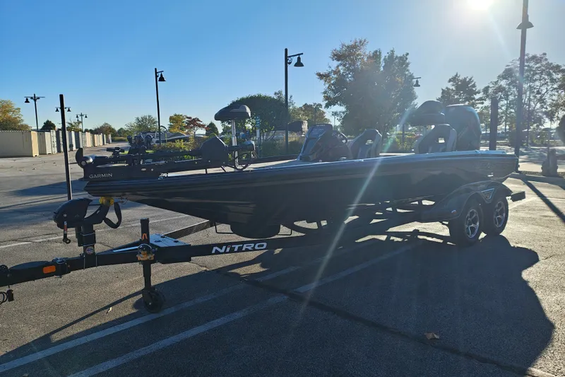 Slide: The Image of 2027 Nitro Z21 XL Pro boat on trailer in sunny parking lot. - 5