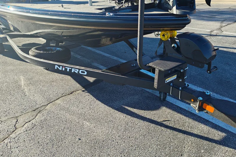 Slide: The Image of 2027 Nitro Z21 XL Pro boat trailer parked on asphalt. - 48