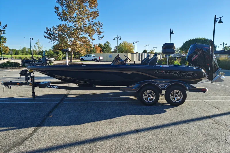Slide: The Image of 2027 Nitro Z21 XL Pro boat on trailer in parking lot, sunny day. - 6