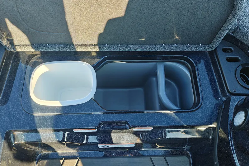 Slide: The Image of Open storage compartment in a 2027 Nitro Z21 XL Pro boat. - 45