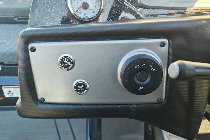 Slide: The Image of Dashboard controls of a 2027 Nitro Z21 XL Pro boat, featuring power and horn buttons. - 16