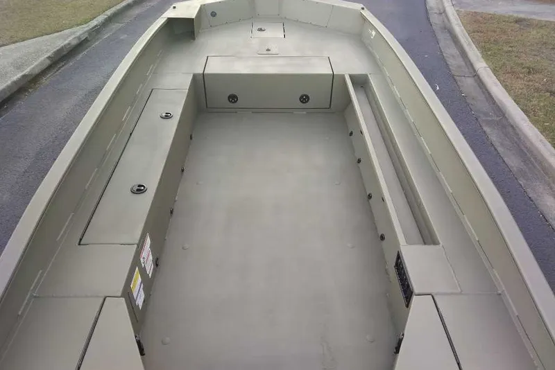 Slide: The Image of 2027 Tracker Grizzly 1756 T Marsh boat interior, showcasing spacious seating and storage areas. - 71