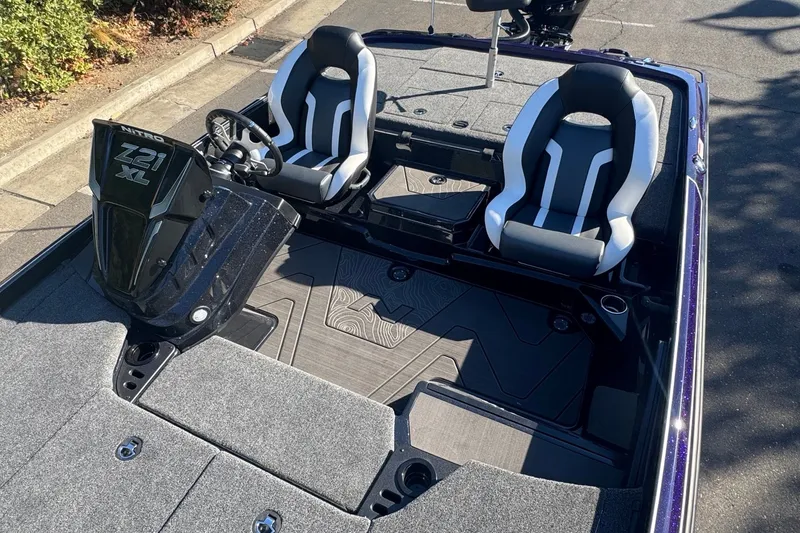Slide: The Image of 2027 Nitro Z21 XL Pro boat interior with dual seats and steering console. - 7