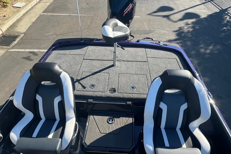 Slide: The Image of 2027 Nitro Z21 XL Pro boat interior with dual seats and carpeted deck. - 8