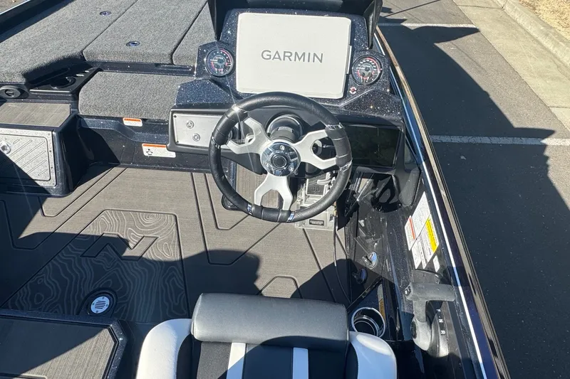 Slide: The Image of 2027 Nitro Z21 XL Pro boat cockpit with Garmin display and modern steering wheel. - 11